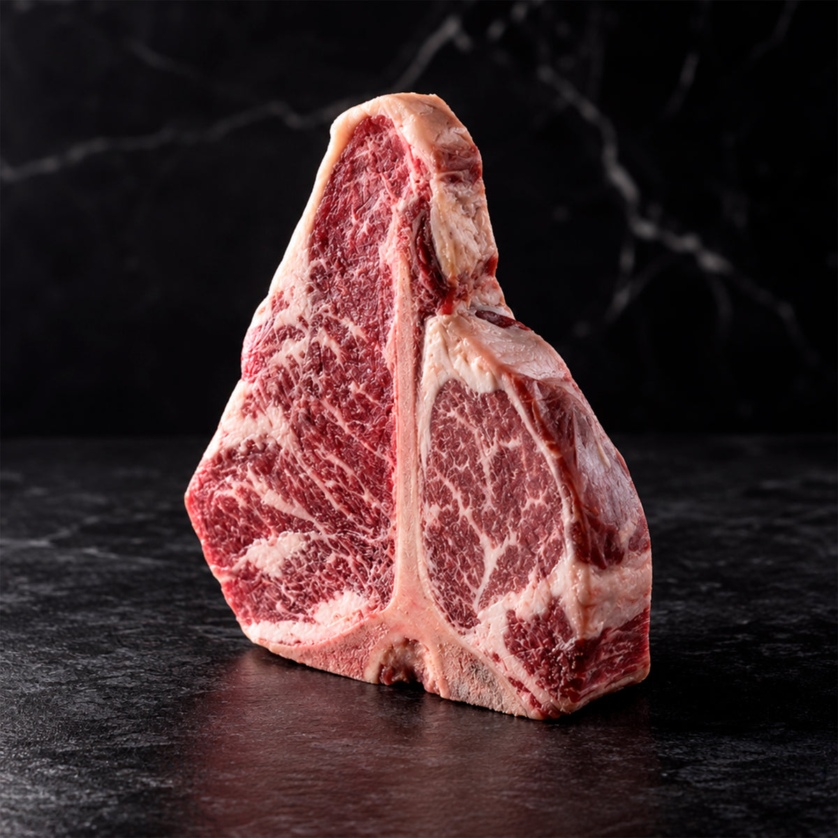 Porterhouse LHA Reserve Dry Aged — detalle de marmoleo en ambos músculos | MEAT MX