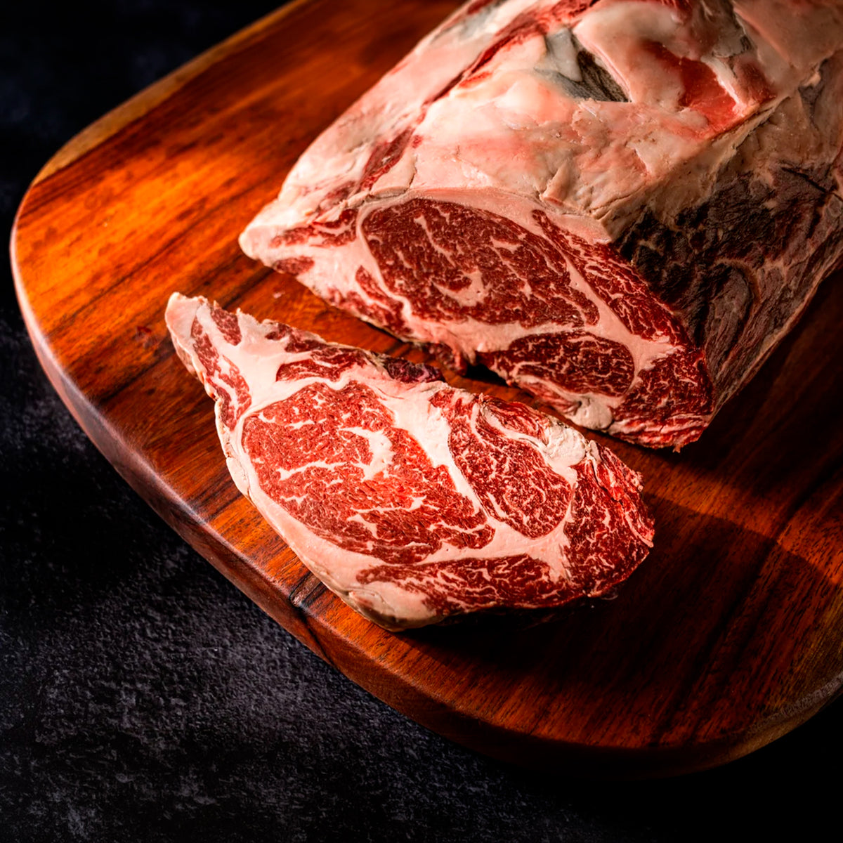 Ribeye LHA Reserve Dry Aged — dos cortes en tabla mostrando la cara de marmoleo | MEAT MX